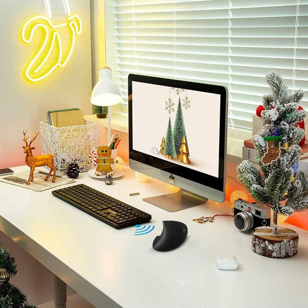 Vertical ergonomic mouse and forearm supported on a desk, set up to reduce wrist and nerve strain